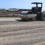 A smooth drum roller is utilized to finish the subgrade and provide a sealed surface.